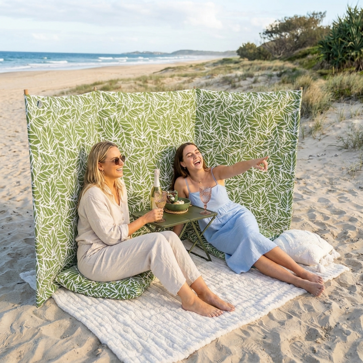 Two Women on the beach with the beach mate